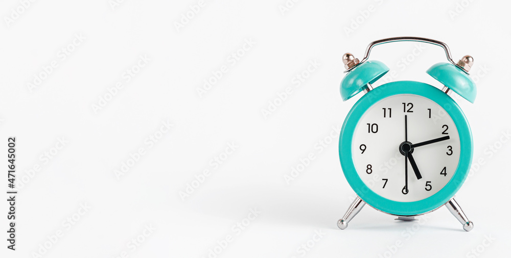Turquoise alarm clock on white background. Banner, copy space. Turquoise alarm clock on white background. Banner, copy space.