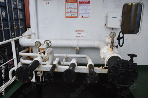 Pipes and manifolds for bunkering to supply of diesel or heavy fuel to fuel tanks of container vessel situated on upper deck from starboard and port side.