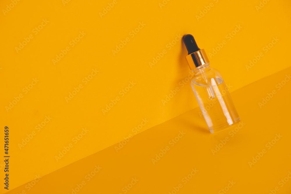 Dropper glass bottles with pipette. Transparent hyaluronic natural beauty mineral product and eco serum skin care concept. Top horizontal view copyspace. Summer juicy colors. Dropper glass bottles with pipette. Transparent hyaluronic natural beauty mineral product and eco serum skin care concept. Top horizontal view copyspace. Summer juicy colors.