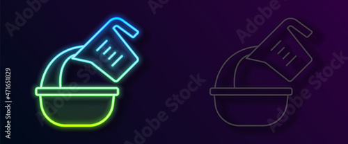 Glowing neon line Measuring cup pouring liquid into bowl icon isolated on black background. Plastic graduated beaker with handle. Vector