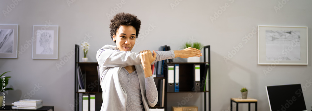 Stretching Exercise At Desk. African American Woman Stretching Exercise At Desk. African American Woman