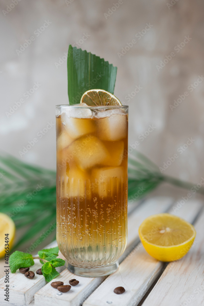 Fototapeta premium cocktail cold with ice espresso tonic glass with lemon with bamboo leaf