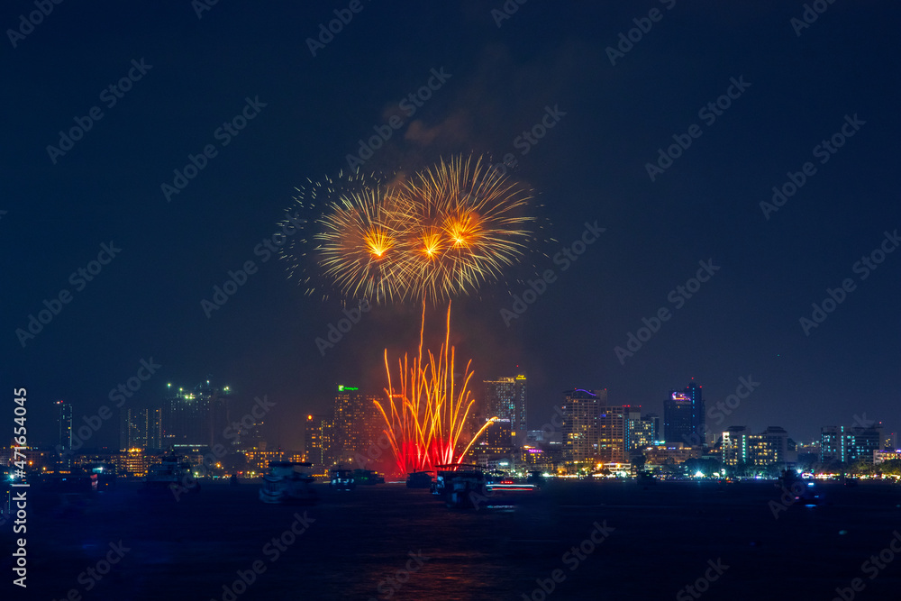 fantastic and colorful fireworks display over the night sky of the city during a festival