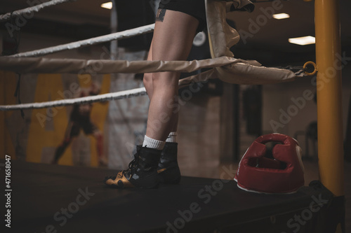  the detail of the legs of a girl ascended to a boxing ring. ©  Yistocking