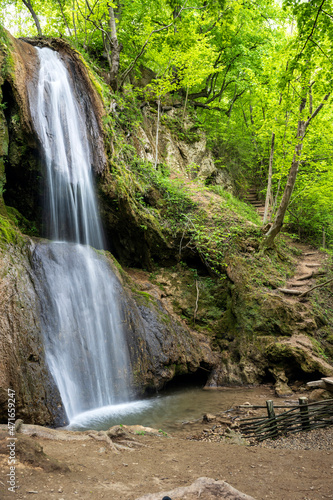 A spectacular waterfall running wild and free as one of  the most  beautiful sights in nature. Natural phenomenon which takes your breath  away.  Waterfall in Serbia. Mountain river waterfall.  