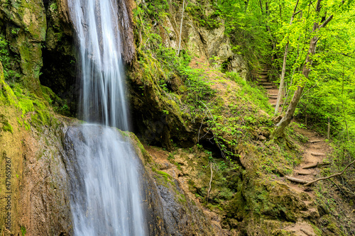 A spectacular waterfall running wild and free as one of  the most  beautiful sights in nature. Natural phenomenon which takes your breath  away.  Waterfall in Serbia. Mountain river waterfall.  