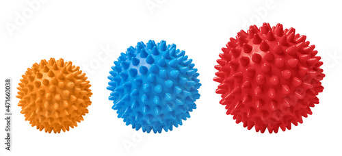 Multicolored spiny massage balls isolated on white. Concept of physiotherapy or fitness. Closeup of a colorful rubber ball for dog teeth on a white color background. Corona virus model.