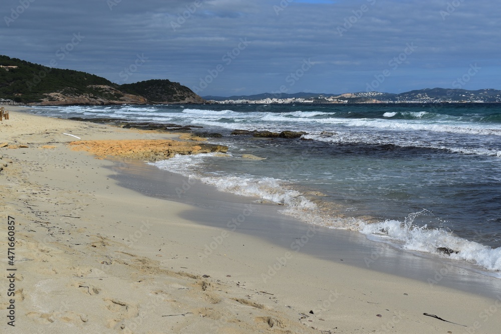
A beach with yellow sand and the sea in the Natural Park Las Salinas, Ibiza