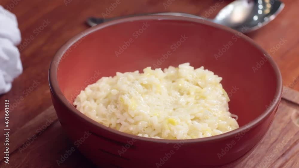 Preparing food. Putting risotto out of the bowl. Preparing food. Putting risotto out of the bowl.