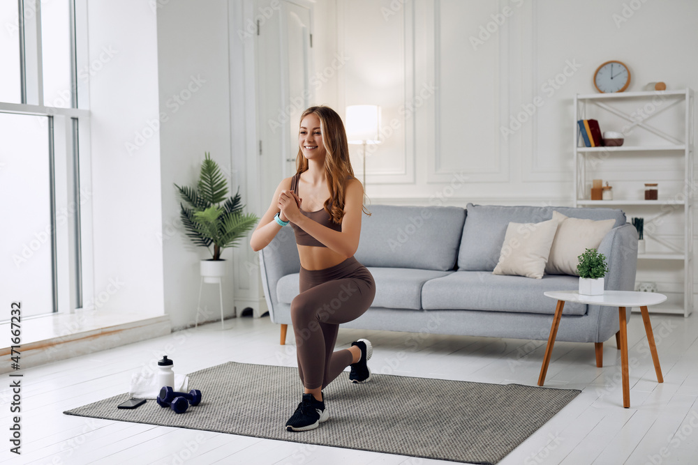 Sport instructor woman doing exercises at home and working hard Sport instructor woman doing exercises at home and working hard