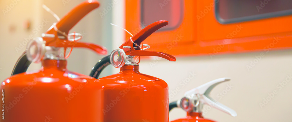 fire-extinguisher-close-up-red-fire-extinguishers-tank-with-fire-hose