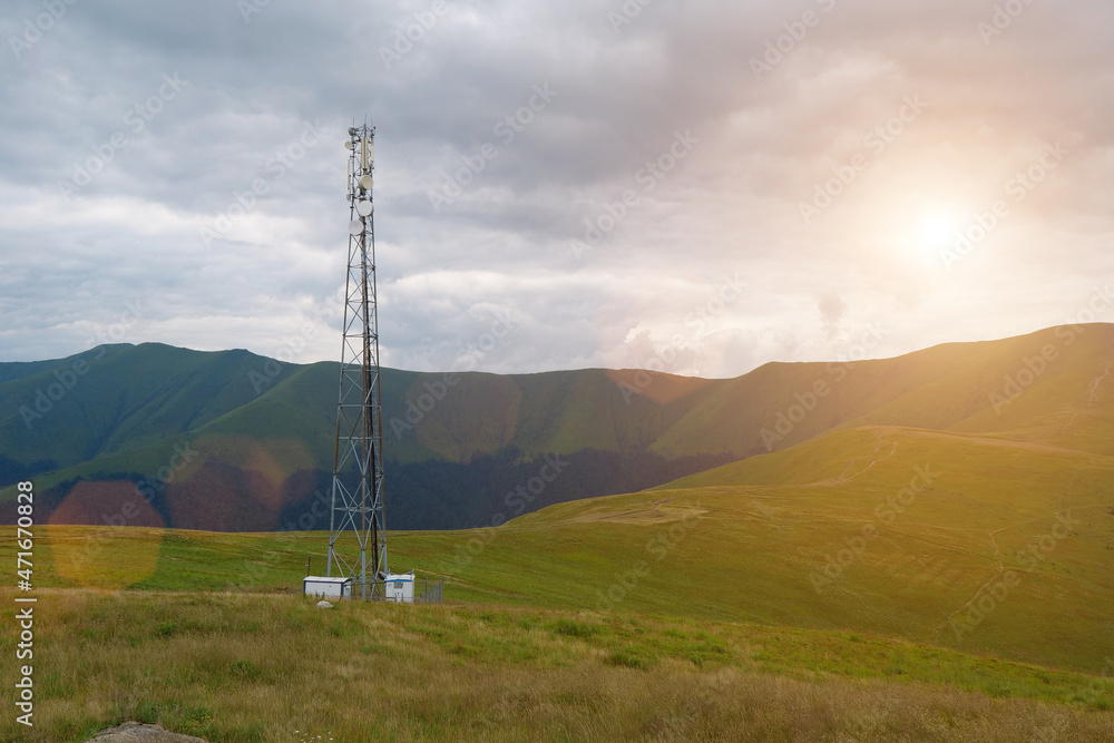 Cell tower and storm clouds in the mountains Cell tower and storm clouds in the mountains
