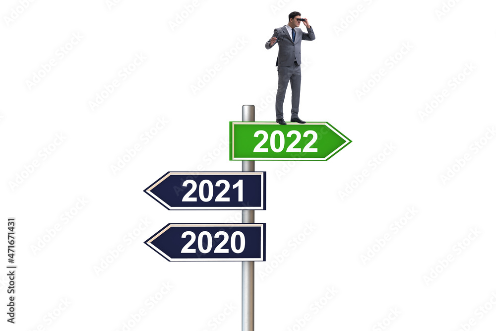Businessman on the signpost from 2021 to 2022 Businessman on the signpost from 2021 to 2022