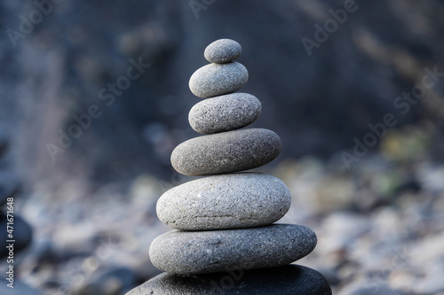 Stone piles made along a beach and the sea in the background. High quality photo