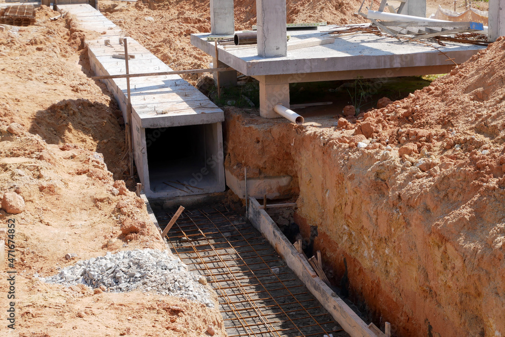 SELANGOR, MALAYSIA -JANUARY 22, 2021: Underground precast concrete box culvert drain under construction at the construction site. It is used to channel stormwater to prevent flash floods.  - obrazy, fototapety, plakaty 