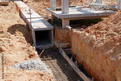 SELANGOR, MALAYSIA -JANUARY 22, 2021: Underground precast concrete box culvert drain under construction at the construction site. It is used to channel stormwater to prevent flash floods.  photo
