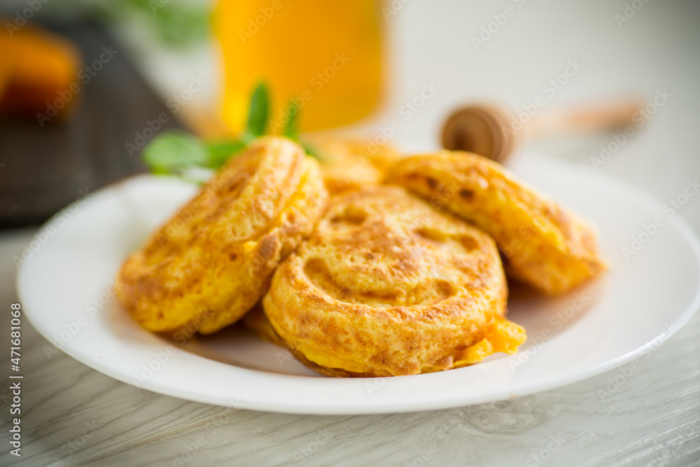 sweet lush pumpkin pancakes with honey in a plate sweet lush pumpkin pancakes with honey in a plate