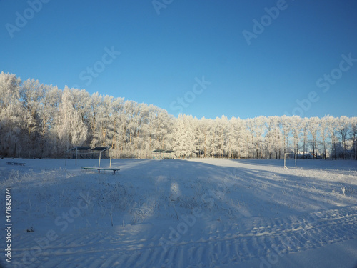 One winter frosty morning. Park, public outdoor stadium. Trees covered with hoarfrost. Winter. Russia, Ural, Perm region. © Max G K