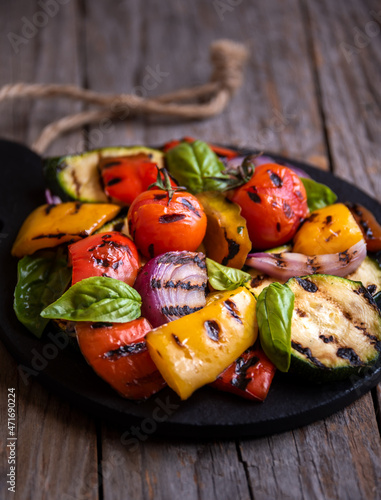 Grilled mixed vegetables, cooked peppers, zucchini, tomatoes and onions. Healthy vegetarian food