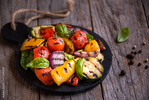 Grilled mixed vegetables, cooked peppers, zucchini, tomatoes and onions. Healthy vegetarian food