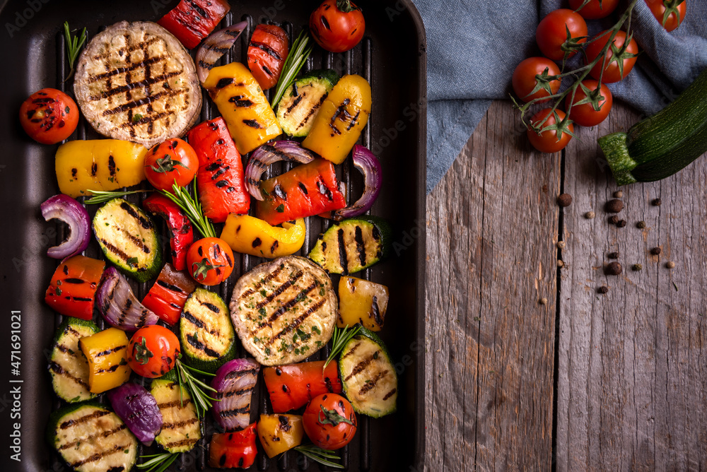 Grilled mixed vegetables, cooked peppers, zucchini, tomatoes and onions. Healthy vegetarian food