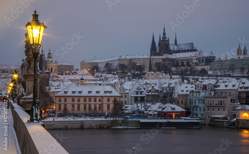 Prague - evening on the snowy Charles Bridge