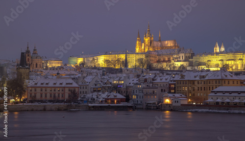 evening Prague in winter - view of snowy Hradcany and Prague Castle