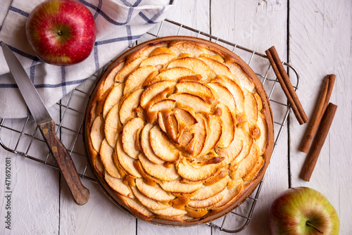 Apple pie, sweet homemade dessert with fresh apples and cinnamon photo