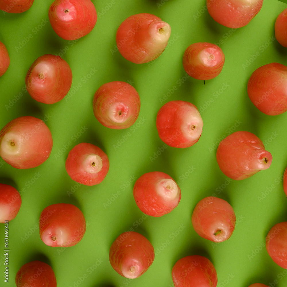 Kahuil fruit red color on green background Kahuil fruit red color on green background