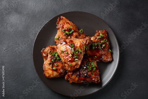 Chicken thighs marinated and cooked in adobo sauce. National filipino dish.