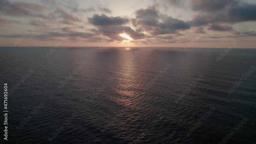 Sunrise over the sea.Epic view of the ocean and reflection of clouds and sun. Sunrise over the sea.Epic view of the ocean and reflection of clouds and sun.
