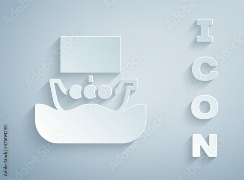 Paper cut Ancient viking scandinavian drakkar icon isolated on grey background. Viking transport ship. Paper art style. Vector