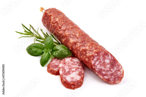 Cured salami with basil, isolated on white background.