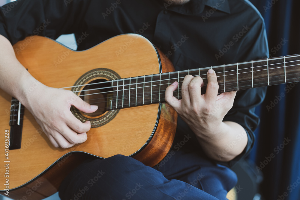 close up view of musician playing guitar