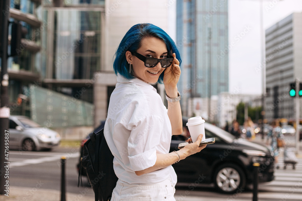 Portrait of beautiful casual women walking outside her office. Portrait of beautiful casual women walking outside her office.