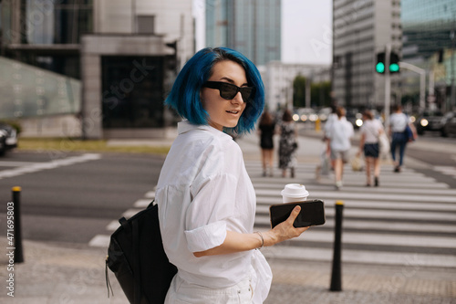 Portrait of beautiful casual women walking outside her office.