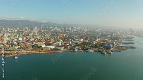 Cityscape: Cebu city with modern buildings, skyscrapers and business centers, top view during sunrise. Philippines.