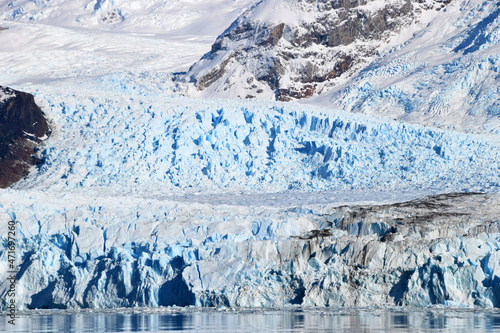 Spegazzini glacier in a beautiful sunny day, showing vibrant blue ice in contrast with white snow, Argentina