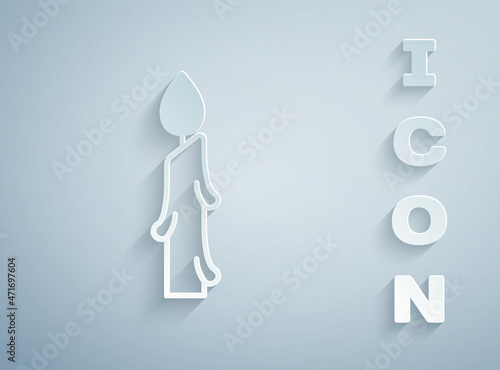 Paper cut Burning candle icon isolated on grey background. Cylindrical candle stick with burning flame. Paper art style. Vector