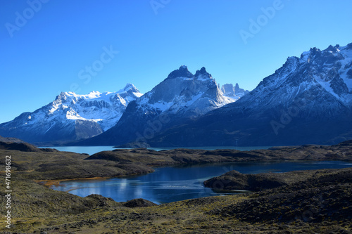 Torres del Paine in a beautiful sunny day showing contrast with the blue sky and white snowy mountain, Argentina Chile © Gabriel