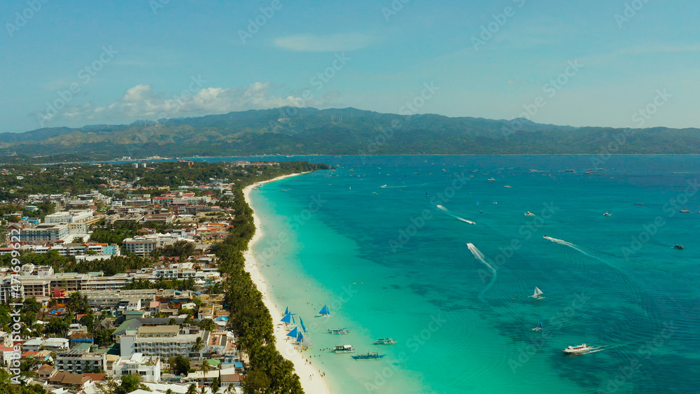 Tropical beach with tourists and clear blue sea, top view. Summer and travel vacation concept. Boracay, Philippines