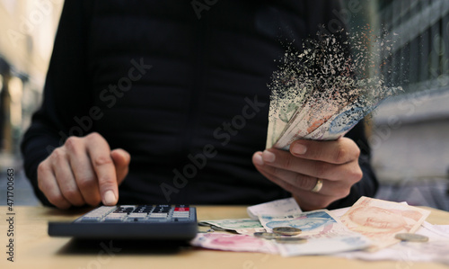 Fototapeta Naklejka Na Ścianę i Meble -  hand holding money. Financial crisis concept