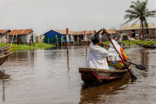 Woman rowing in Ganvi    Benin on Lake Nokoue. 