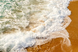 waves on the coastline of the beach in the day time, top angled view