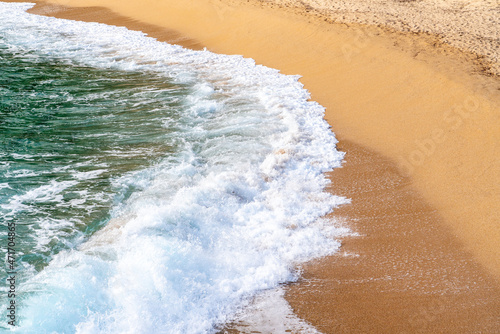 waves on the coastline of the beach in the day time, top angled view