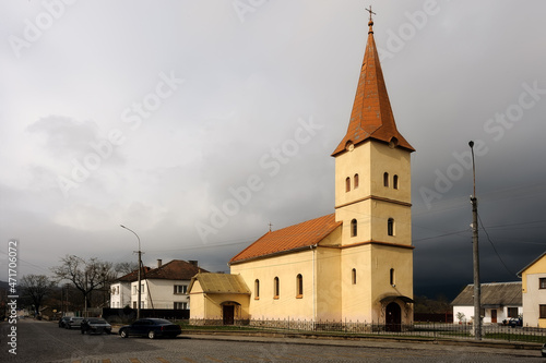 Svalyava cityscape with polish Church of Dormition of the Mother of God in Ukraine before storm