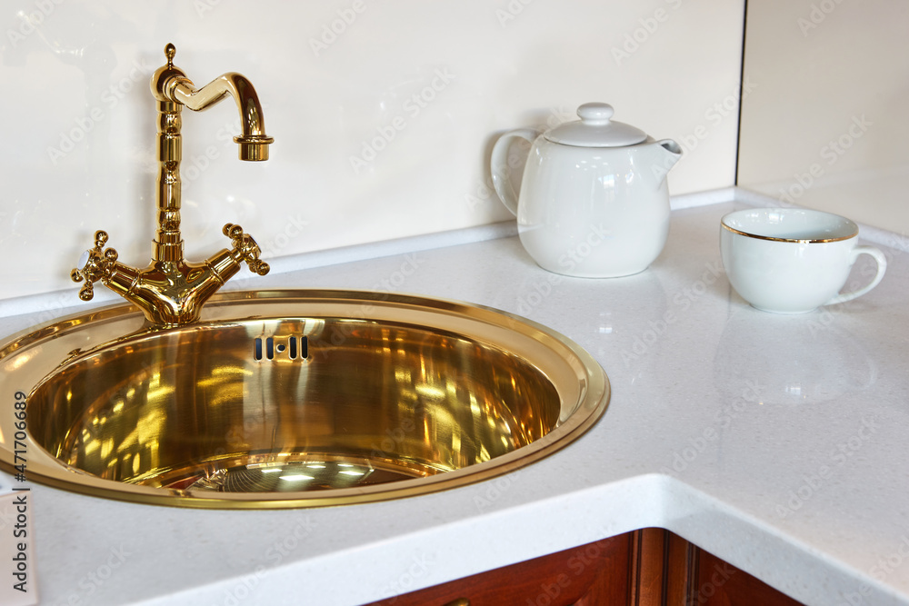 golden vintage luxury faucet with kitchen sink