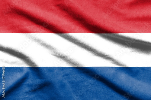 Netherlands flag on wavy fabric.
