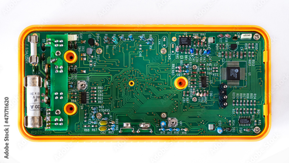 Detailed image of an electronic circuit of a multimeter for measurements of electric currents and voltage. Detailed image of an electronic circuit of a multimeter for measurements of electric currents and voltage.