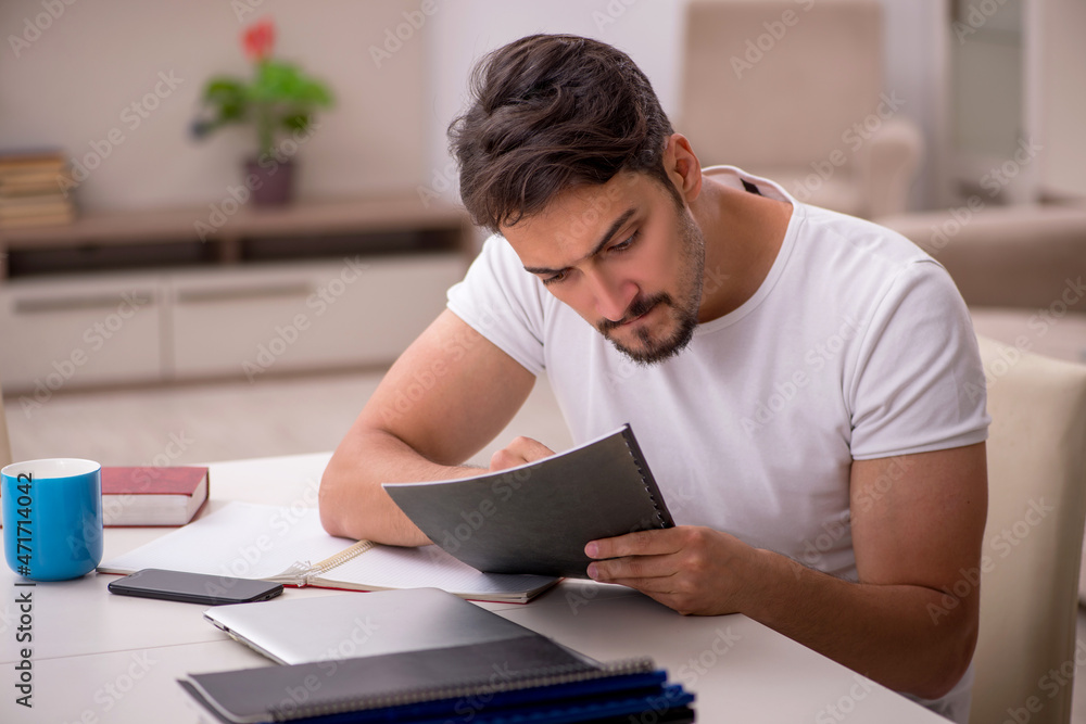 Young male employee working from home during pandemic Young male employee working from home during pandemic